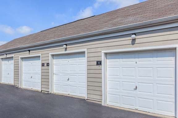 A group of detached garages in the parking lot at Stonebriar Woods Apartments.