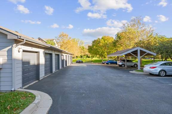 A parking lot with cars at Crowne Chase Apartment Homes, Overland Park, KS