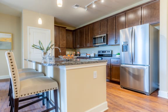 Chef-Inspired Kitchens Feature Stainless Steel Appliances at The Residences at Bluhawk Apartments, Overland Park