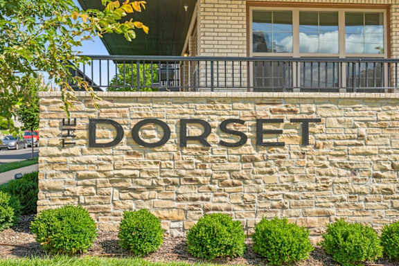 The Dorset Apartments monument sign made of stone bricks.