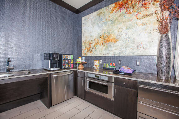 clubhouse cafe with coffee bar and kitchen at Ovation at Lewisville Apartments, Texas