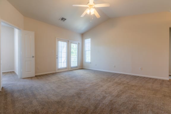 Wooden flooring with ceiling fan and light at Wynnewood Farms Apartments, Overland Park, KS