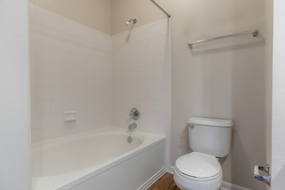 Bathroom with bath tub at Wynnewood Farms Apartments, Kansas