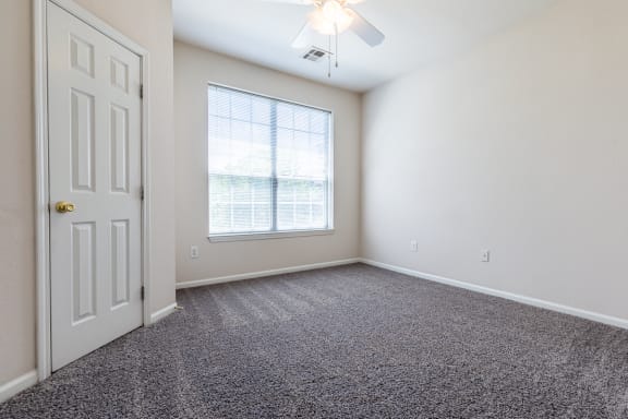 Carpeted Bedroom Area at Crowne Chase Apartment Homes, Overland Park, KS