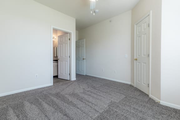 Carpeted Bedroom Space at Crowne Chase Apartment Homes, Overland Park, 66210