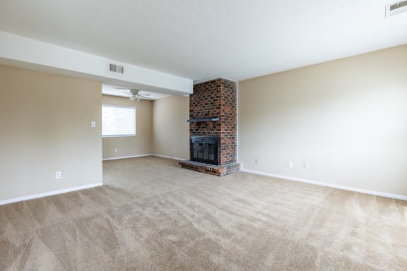 Living room with fireplaceat Preston Court Apartments, Overland Park, 66212