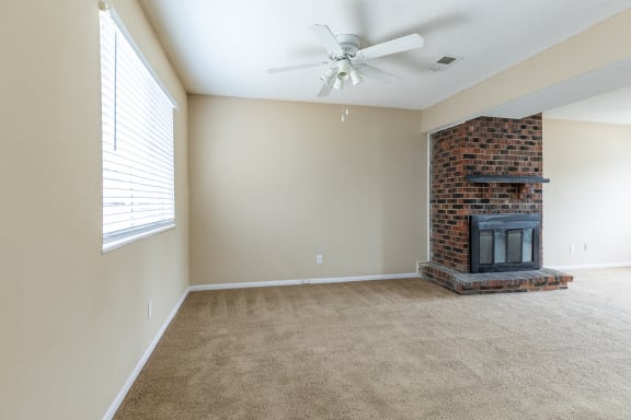 Living room with fireplace 1at Preston Court Apartments, Overland Park, Kansas
