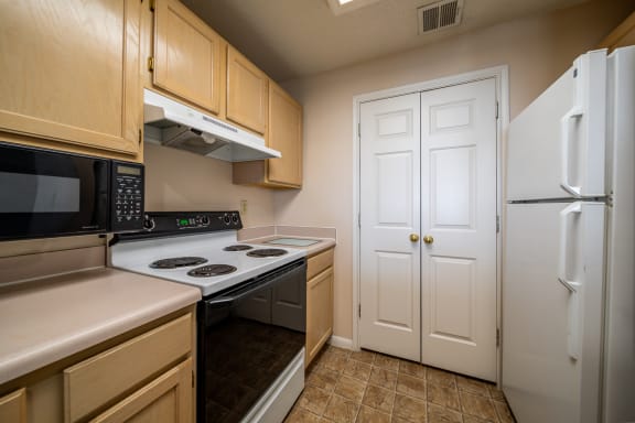Fully Equipped Kitchen Includes Frost-Free Refrigerator, Electric Range, & Dishwasher at Claremont, Overland Park, 66210