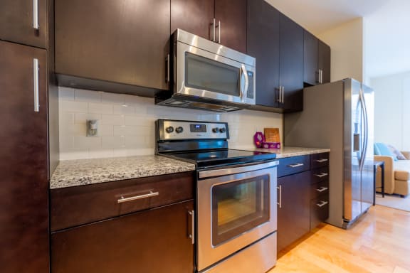 Wooden cabinet and steel applainces at West 39th Street Apartments, Kansas City, MO, 64111