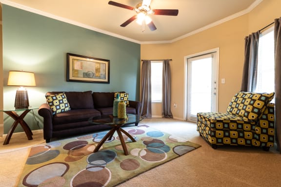 living room with furniture within two bedroom floorplan at Wade Crossing Apartment Homes , Texas 75035