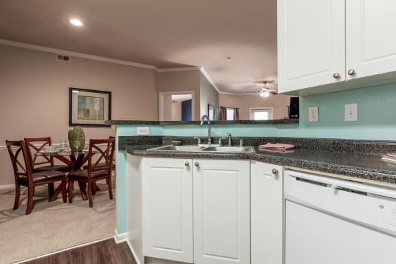 kitchen displaying sink and dishwasher within two bedroom floorplan at  Wade Crossing Apartment Homes , Frisco, 75035