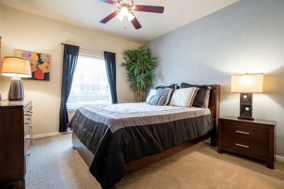 guest bedroom with furniture within two bedroom apartment at  Wade Crossing Apartment Homes , Frisco, 75035