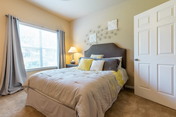 bedroom of apartment with furniture at Wade Crossing Apartment Homes , Texas 75035