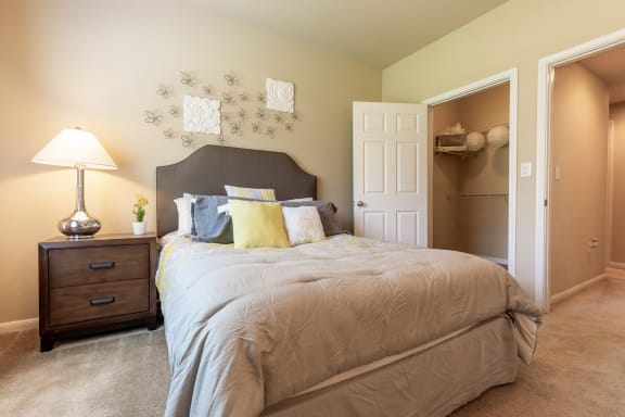 Furnished bedroom within one bedroom apartment with furniture at Wade Crossing Apartment Homes , Texas