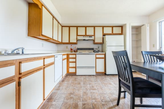 Well Equipped Kitchen And Dining at Millcreek Woods Apartments, Olathe, KS, 66061