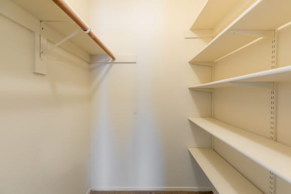 Generous Walk-In Closets With Shelving at Coventry Oaks Apartments, Overland Park, KS