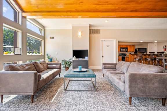 Resident lounge with comfortable seating and access to clubhouse amenities.
