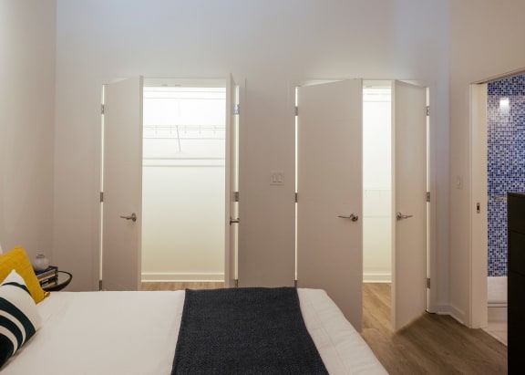 a bedroom with white walls at Sky on Main in Kansas City, 64105