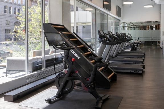 a row of exercise bikes in a gym at Sky on Main in Kansas City, 64105