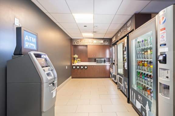 Self-service micro market at Sky on Main with vending machines offering snacks, beverages, and convenience items for residents.