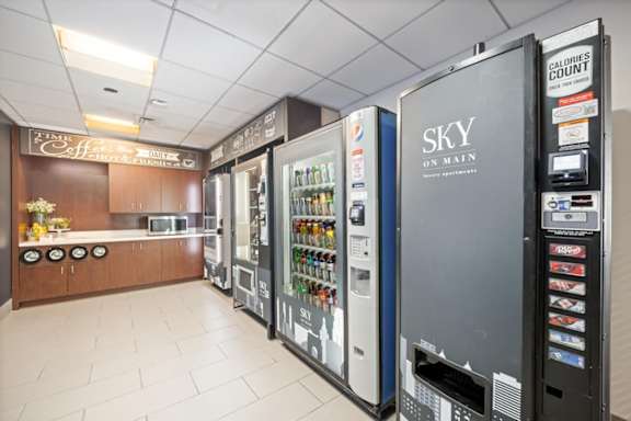 Self-service micro market at Sky on Main with vending machines offering snacks, beverages, and convenience items for residents.