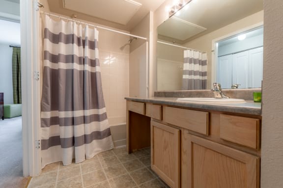 Vanity in bathroom with shower at Stonepost Lakeside, Olathe, KS