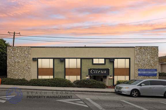A building with the name Citrus on it is shown with a car parked in front.