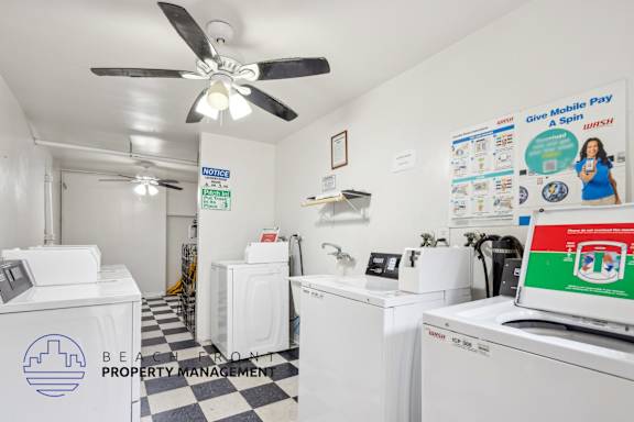 A laundromat with a sign that says "Give Mobile Pay a Spin!" is shown.