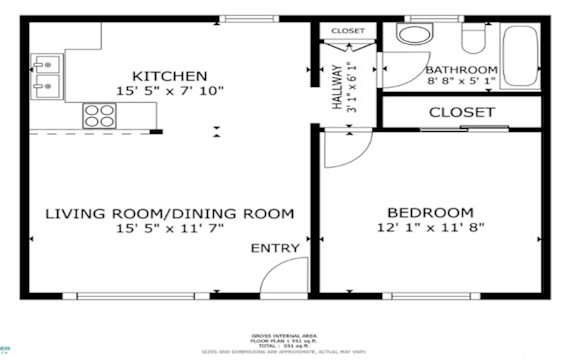 A floor plan of a small apartment with a kitchen, living room/dining room, bedroom, and bathroom.
