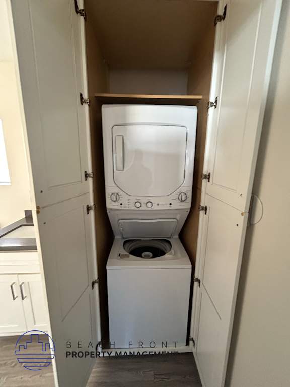 A washing machine is installed in a small laundry room.