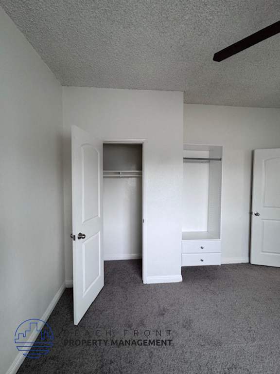 A room with a white door and a white cabinet.