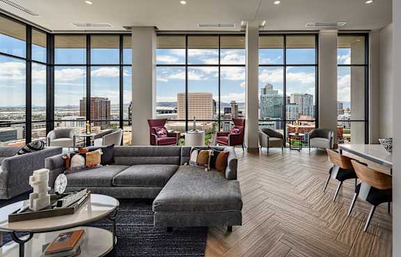 A living room with a grey couch and a coffee table.