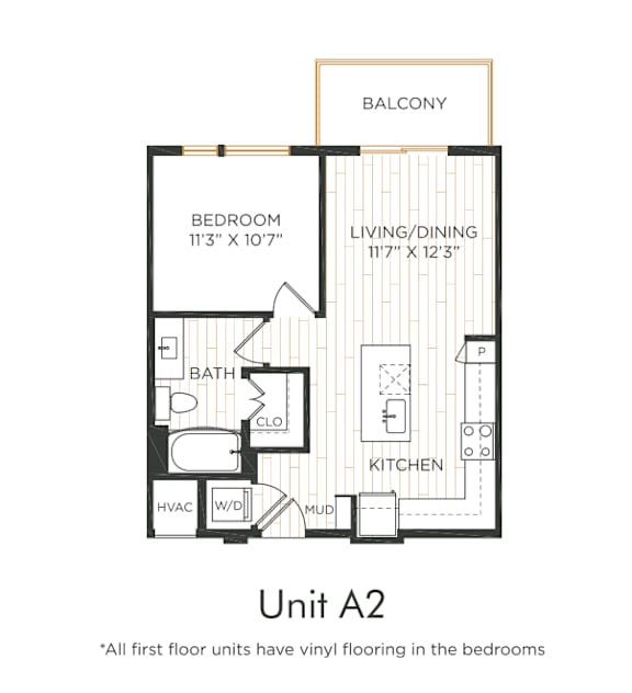 One-bedroom apartment with entry into the kitchen featuring an island and adjacent living/dining area with balcony access. Bedroom with direct bathroom access and nearby closet space. In-unit washer and dryer and mud area included.