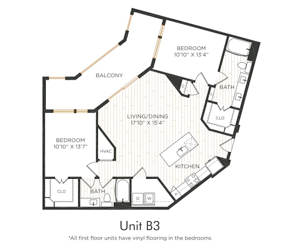Two-bedroom apartment with entry into the kitchen featuring an island and adjacent living/dining area with oversized balcony access. Split-bedroom layout with each bedroom offering nearby bathroom access and closet space. Primary bedroom includes dual vanities and a larger closet. In-unit washer and dryer included.