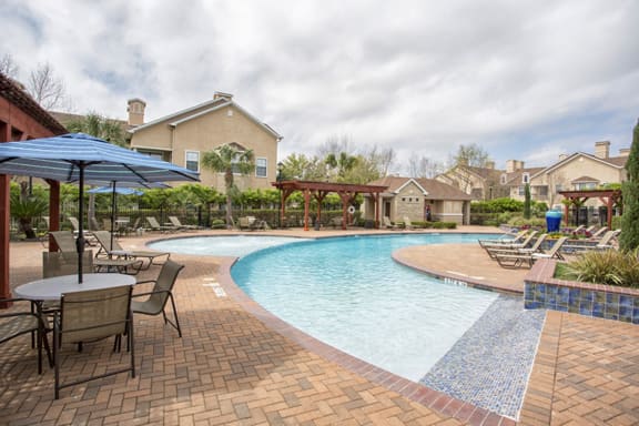 poolside lounge in our apartments in webster tx