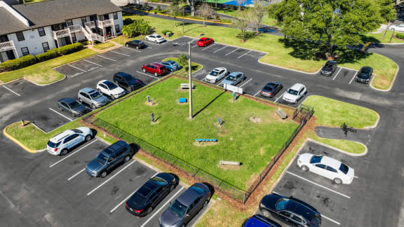 an aerial view of cars parked in a parking lot