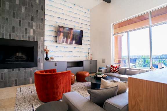 A living room with a fireplace and a couch.