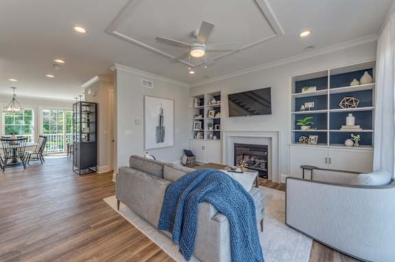 A living room with a fireplace and a couch.