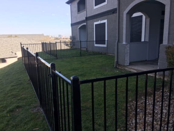 Fenced Yard at Ellie Apartments - Austin, TX