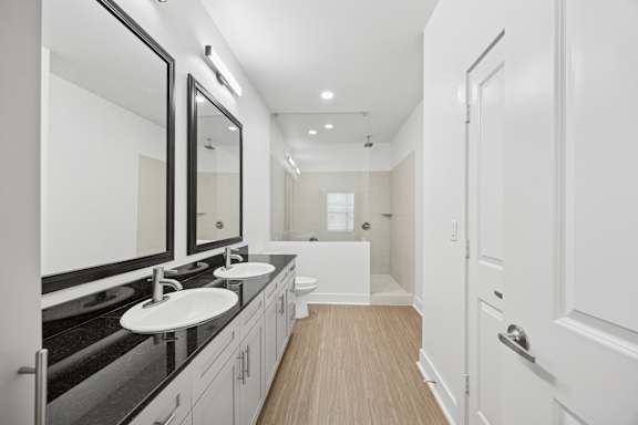 A bathroom with a sink and mirror.