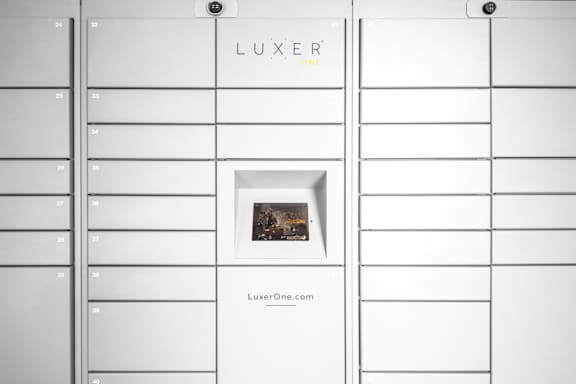 A white display board with the word LUXER on it.