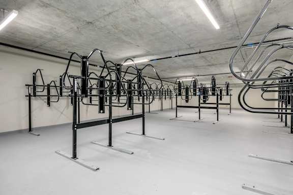A gym with a row of exercise bikes.