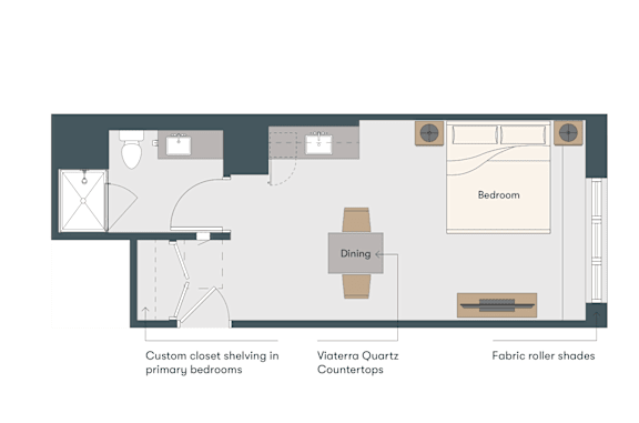 A floor plan of a room with a dining area, a bedroom, and a kitchen.