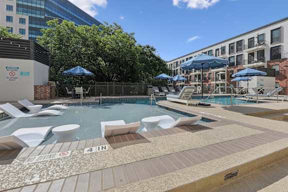 A pool area with a sign that says "4 IN".