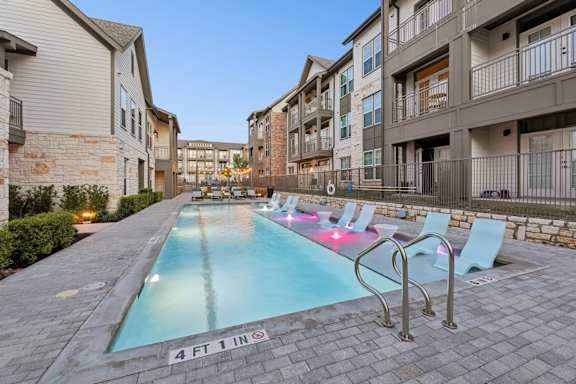 A swimming pool with a 4 feet 1 inch depth marker.