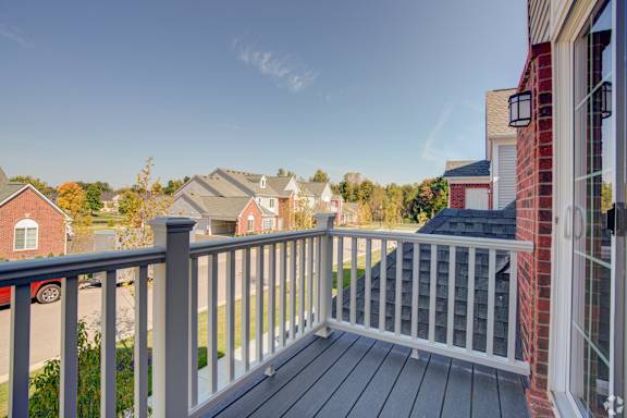 the deck of a home with a view of the neighborhood