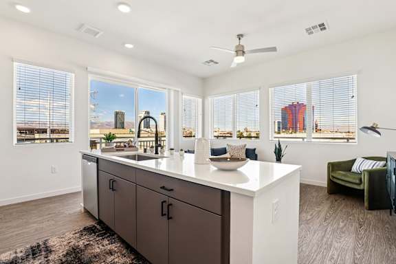 A kitchen with a large island and a view of the city. at Lura Vegas Apartments, Nevada, 89103