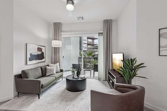 Living Room with Window Curtains at Coya Apartments, Las Vegas, 89102
