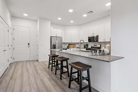 Large Island Kitchen With Custom Cabinetry at Coya Apartments, Nevada, 89102