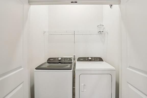 A laundry room with a washer and dryer. at Lura Vegas Apartments, Las Vegas, NV